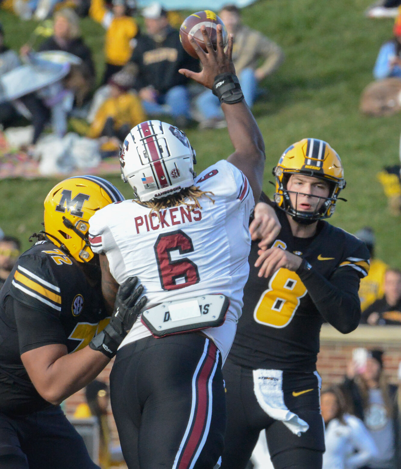 Zacch Pickens reaches up to block the pass from Connor Bazelak